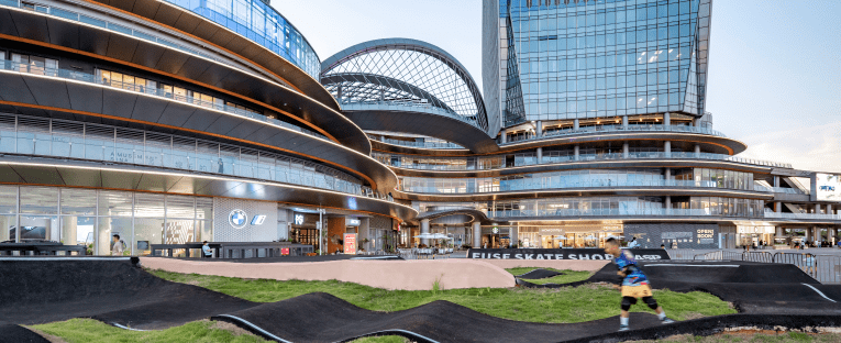 a contemporary building, capturing a moment of urban sport and movement.