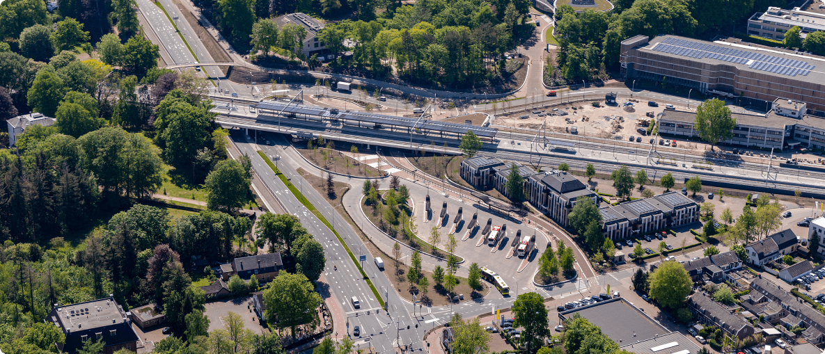 Aerial view of Amsterdam, showcasing its iconic canals, bridges, and historic architecture.