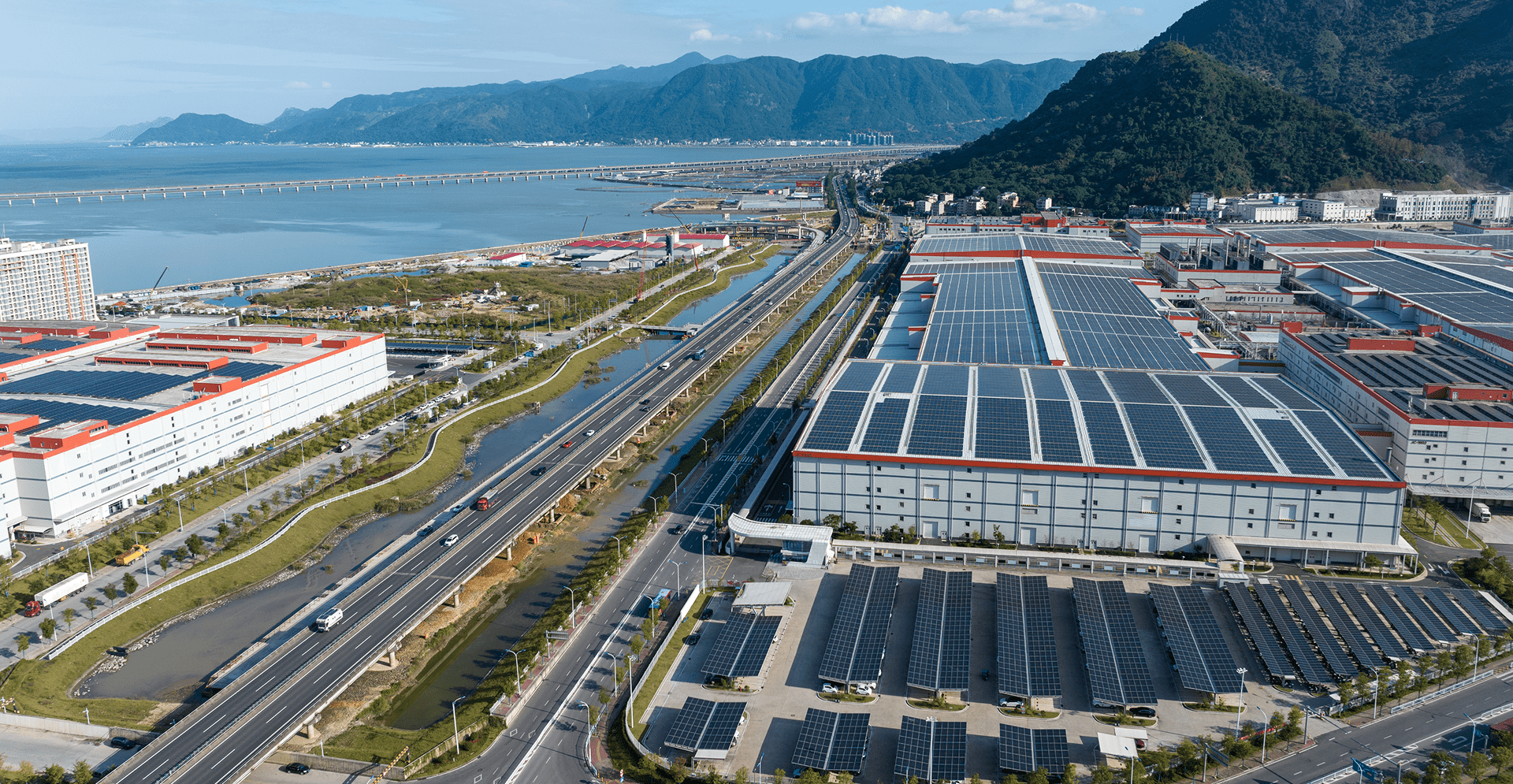 Aerial view of a solar power plant in China, featuring extensive solar panel arrays and surrounding landscape.